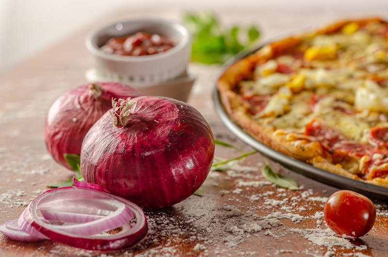 BBQ Chicken pizza with smoky sauce and red onions