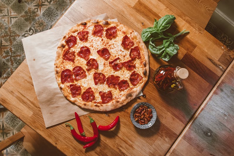 Spicy Arrabbiata custom pizza with chili flakes and hot peppers