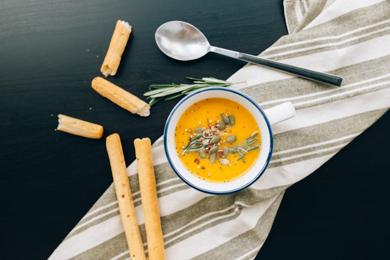 Golden garlic breadsticks with herbs and dipping marinara