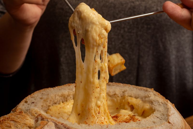 Cheesy pull-apart bread loaded with melted cheese and herbs