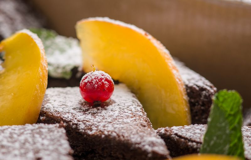 Warm chocolate brownie dessert with powdered sugar