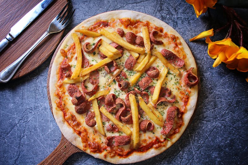 White Garlic pizza with creamy sauce and fresh herbs